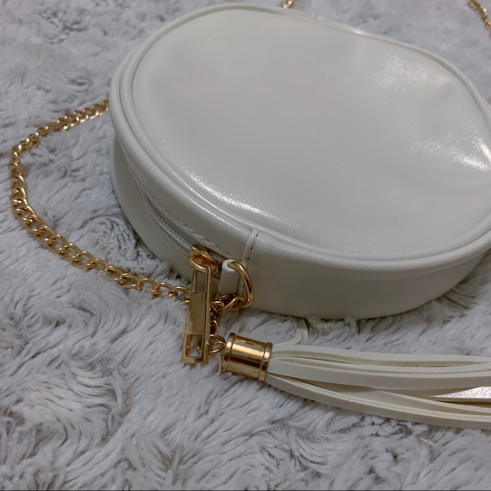 small white and gold shoulder bag